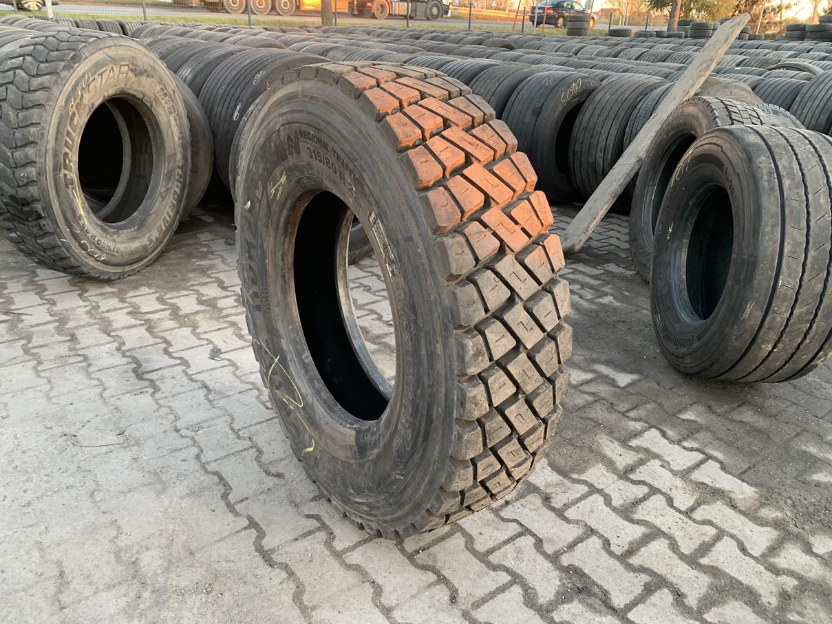 Opony ciężarowe Opona używana ciężarowa napędowa budowlana 315/80R22.5 BIEŻNIKOWANA TYP CONTINENTAL HDC1 / 100% Bieżnika